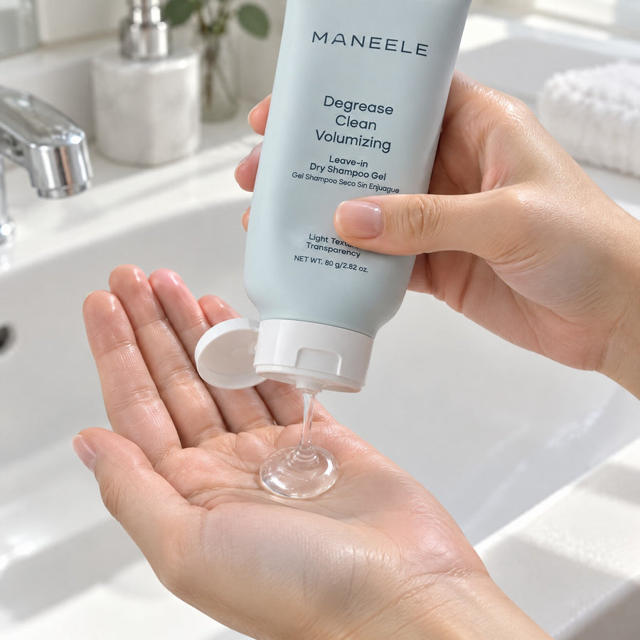 Woman squeezing a coin-sized drop of clear gel from the Maneele tube into her palm