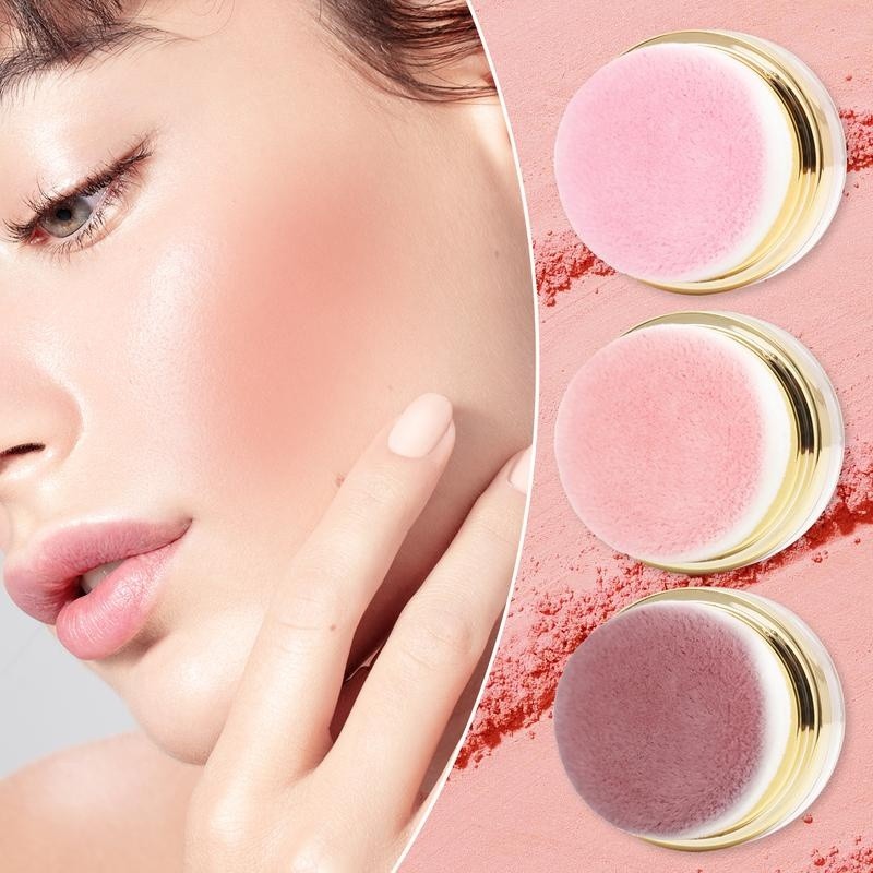 Soft pink flush on the cheek next to the three puff jars