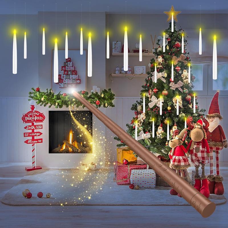 Floating candles above a Christmas tree and fireplace with the wand remote