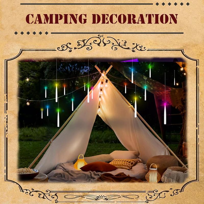 Floating candles strung above a camping tent at night