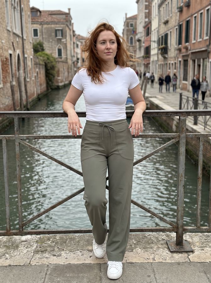 Sage wide-leg trousers by a canal