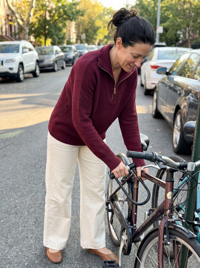 Burgundy half-zip knit with a bicycle