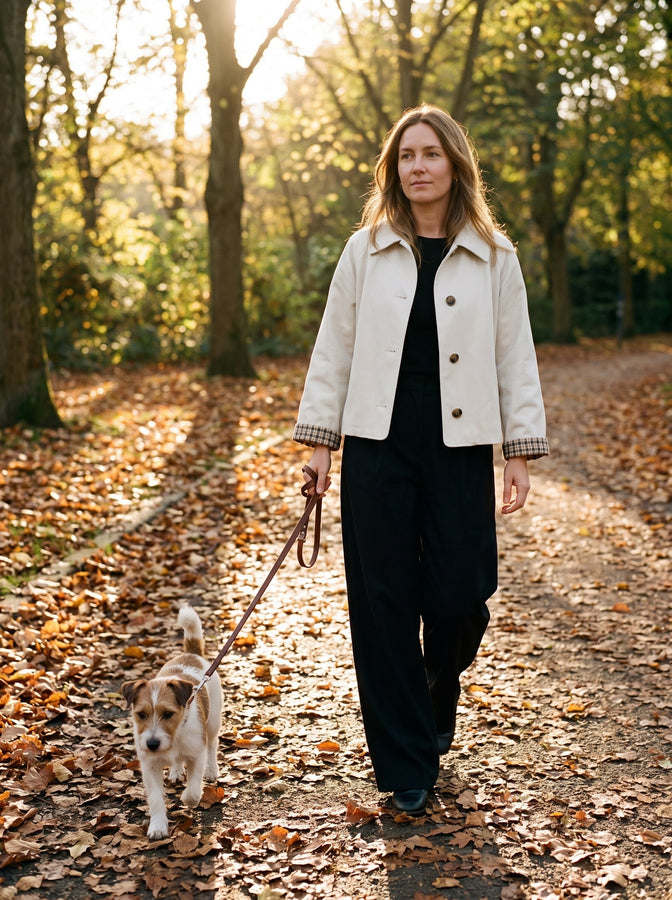 Cream cropped trench on an autumn park path