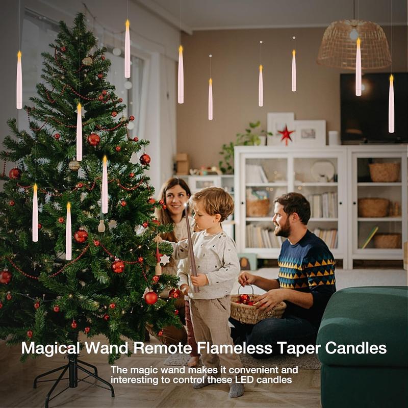 Family decorating a Christmas tree under floating LED taper candles