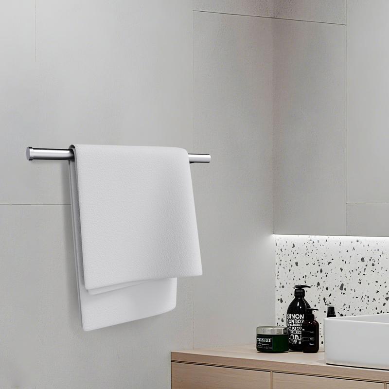 Brushed steel holder used as a bathroom towel rail